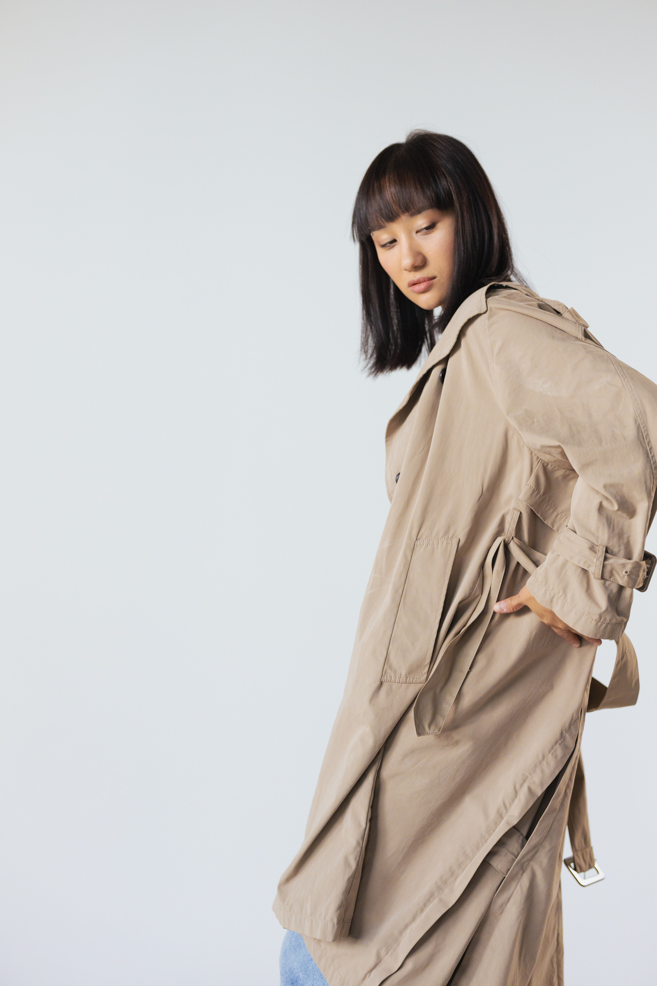 A Woman Wearing Beige Trench Coat